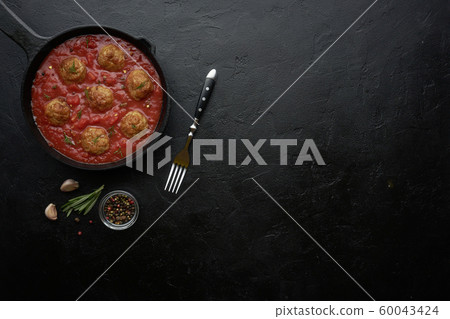 Pan with meat balls in tomato sauce. Flat lay, top view with copy space Pan with meat balls in tomato sauce. Flat lay, top view with copy space 60043424