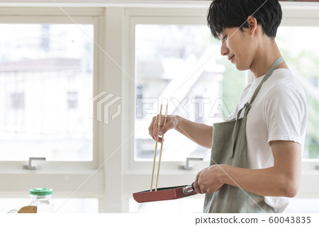 Young male cooking boy image 60043835