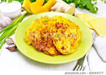 Pancakes of pumpkin with cheese in green plate_5 60044577