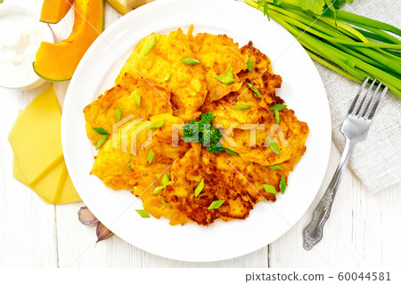 Pancakes of pumpkin with cheese in plate on top Pancakes of pumpkin with cheese in plate on top 60044581
