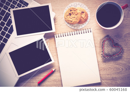 Blank photo frames on table 60045168