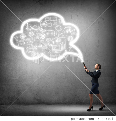 Woman throwing light on her ideas Woman throwing light on her ideas 60045401