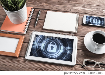 Web security and technology concept with tablet pc on wooden table Web security and technology concept with tablet pc on wooden table 60045406
