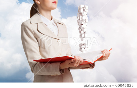 Attractive woman holding open notebook 60045823