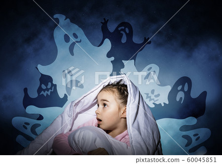 Excited girl hiding under blanket Excited girl hiding under blanket 60045851