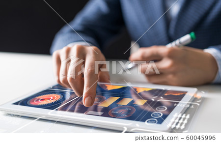 Businessman analysis trading diagram at tablet 60045996