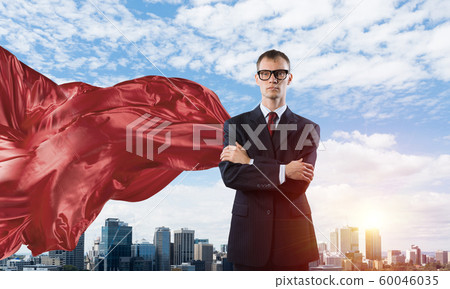 Concept of power and sucess with businessman superhero in big city 60046035