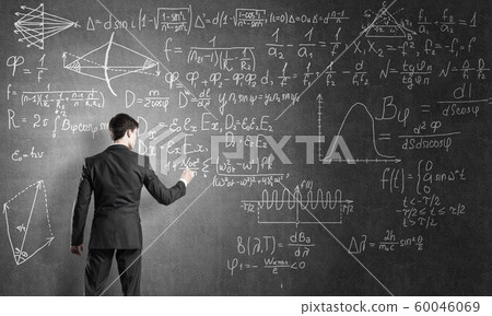 Man writing on blackboard 60046069