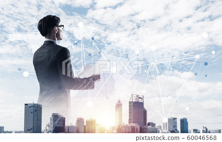 Concept of business success and control with confident boss against cityscape background Concept of business success and control with confident boss against cityscape background 60046568