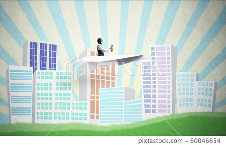 Businessman in aviator hat sitting in paper plane Businessman in aviator hat sitting in paper plane 60046654