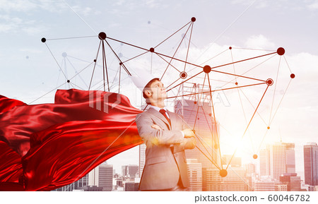 Concept of power and sucess with businessman superhero in big city Concept of power and sucess with businessman superhero in big city 60046782