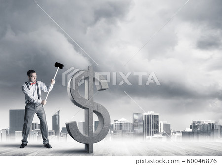 Determined banker man against modern cityscape breaking dollar concrete figure Determined banker man against modern cityscape breaking dollar concrete figure 60046876