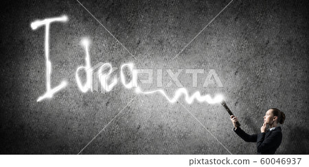 Woman with flashlight in hand Woman with flashlight in hand 60046937