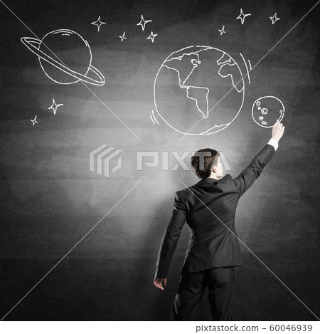 Man draw on chalkboard Man draw on chalkboard 60046939