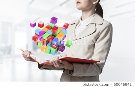 Woman showing colorful geometric 3d cubes 60046941