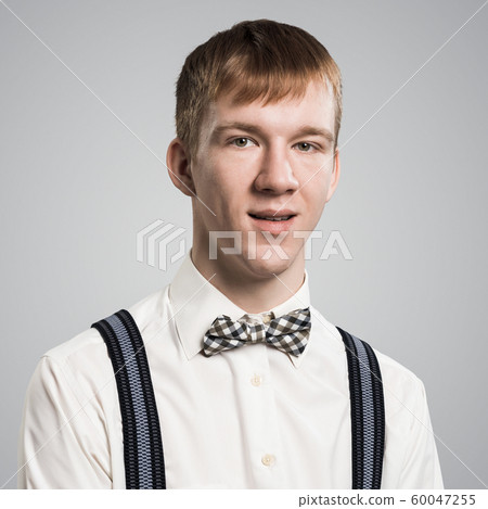 Smiling hipster with satisfied and pleasant look Smiling hipster with satisfied and pleasant look 60047255