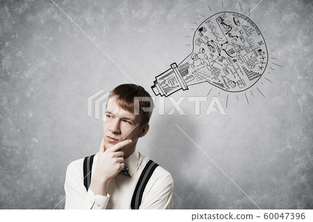 Redhead student thinking about some problem 60047396