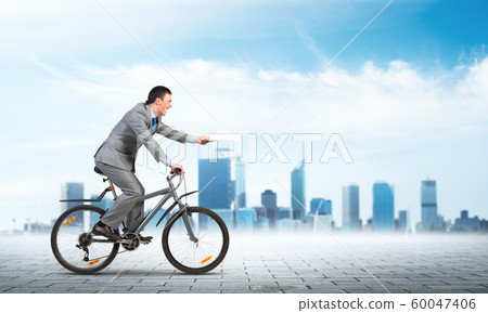 Businessman with paper documents in hand Businessman with paper documents in hand 60047406