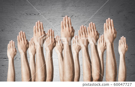 Row of man hands showing voting gesture Row of man hands showing voting gesture 60047727