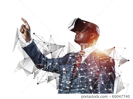 Black man standing with VR headset 60047740