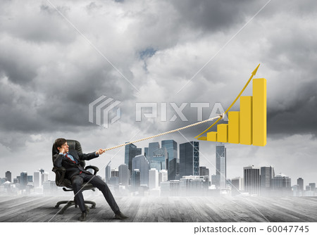 Man pulling with effort big pulling rope graph, as a symbol of financial growth Man pulling with effort big pulling rope graph, as a symbol of financial growth 60047745