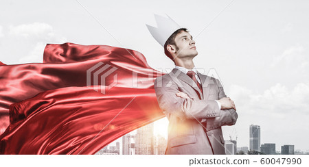 Concept of power and sucess with businessman superhero in big city Concept of power and sucess with businessman superhero in big city 60047990