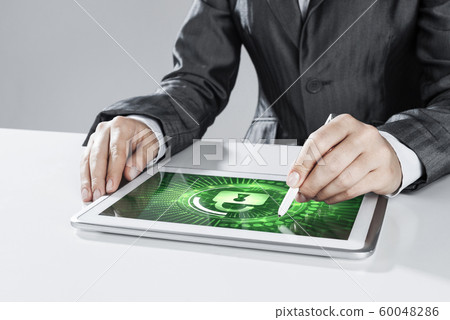 Internet security concept with woman working on media screen with stylus Internet security concept with woman working on media screen with stylus 60048286