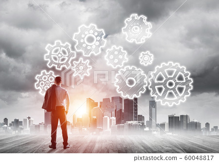 Cogwheel engine drawn on screen as symbol for teamwork and cooperation 60048817