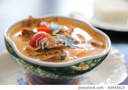 Roasted Duck in Red Curry with rice , Traditional Thai food 60048823
