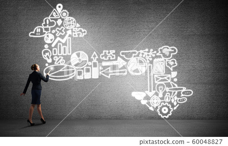 Woman throwing light on her ideas Woman throwing light on her ideas 60048827