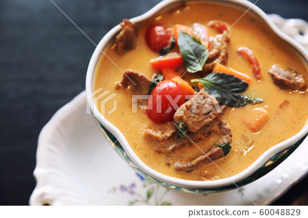 Roasted Duck in Red Curry with rice , Traditional Thai food 60048829