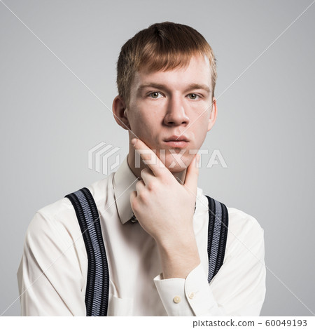 Boy having serious and calm face. 60049193