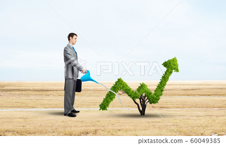 Green plant in shape of of grow up trend 60049385