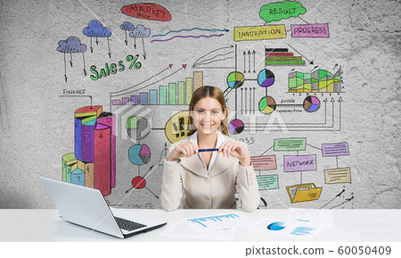 Thoughtful businesswoman sitting at table Thoughtful businesswoman sitting at table 60050409