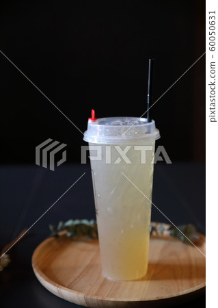 Lemon juice in black background 60050631