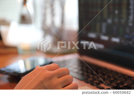 Woman hand working at coffee shop hand on keyboard with close up Woman hand working at coffee shop hand on keyboard with close up 60050682