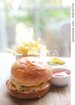 Beef Hamburger with fries and ketchup on wood bard , fast food Beef Hamburger with fries and ketchup on wood bard , fast food 60050724