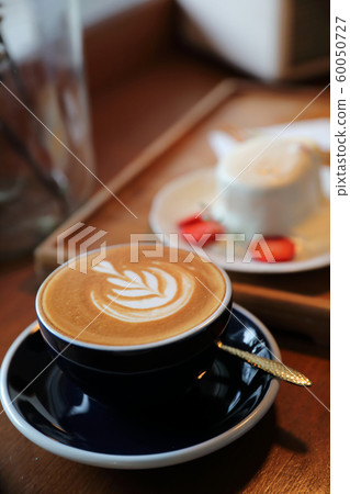 Cappuccino coffee break on wood background Cappuccino coffee break on wood background 60050727