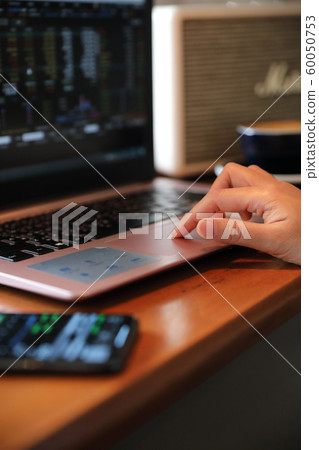 Woman hand working at coffee shop hand on keyboard with close up Woman hand working at coffee shop hand on keyboard with close up 60050753