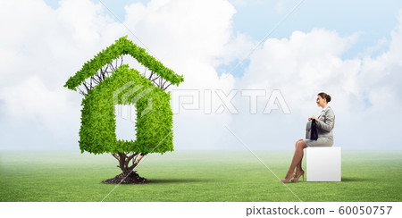 Attractive business lady or accountant outdoors on white box Attractive business lady or accountant outdoors on white box 60050757