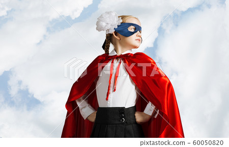 Girl power concept with cute kid guardian against sky background 60050820