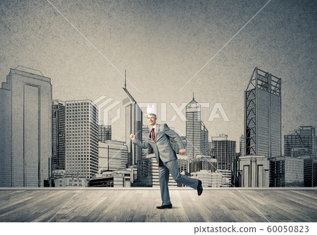 King businessman in elegant suit running and drawn cityscape silhouette at background King businessman in elegant suit running and drawn cityscape silhouette at background 60050823