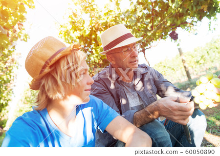 Two generations of vintners outdoor together Two generations of vintners outdoor together 60050890
