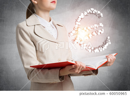 Businesswoman with euro currency sign Businesswoman with euro currency sign 60050965