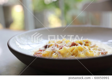 fettuccine carbonara , fettuccine pasta spaghetti with bacon ham and mushroon in white sauce italian food fettuccine carbonara , fettuccine pasta spaghetti with bacon ham and mushroon in white sauce italian food 60050991