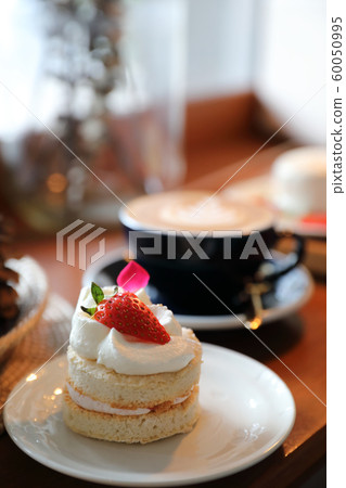 Strawberry cake dessert on wood table Strawberry cake dessert on wood table 60050995