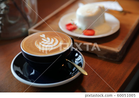 Cappuccino coffee break on wood background Cappuccino coffee break on wood background 60051005
