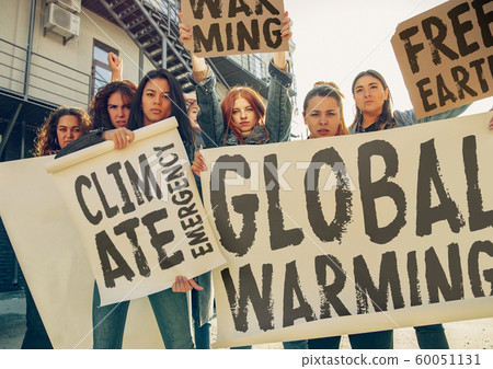 Young people protesting of climate emergency on the street 60051131