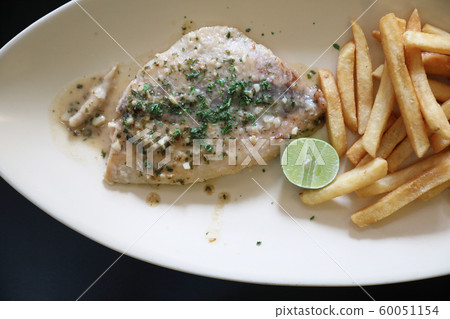 Halibut fillet steak with chips Halibut fillet steak with chips 60051154