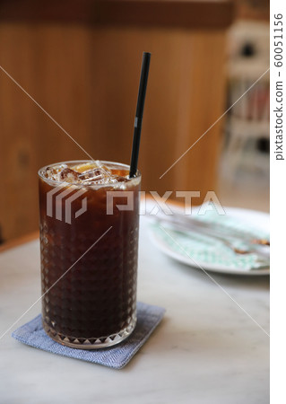 Ice americano coffee in coffee shop Ice americano coffee in coffee shop 60051156